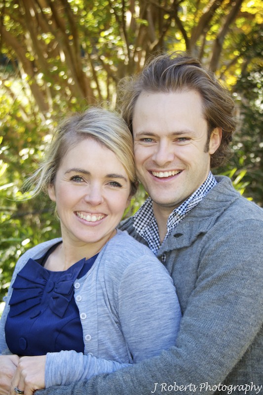 Couple smiling with autumn colours - family portrait photography sydney